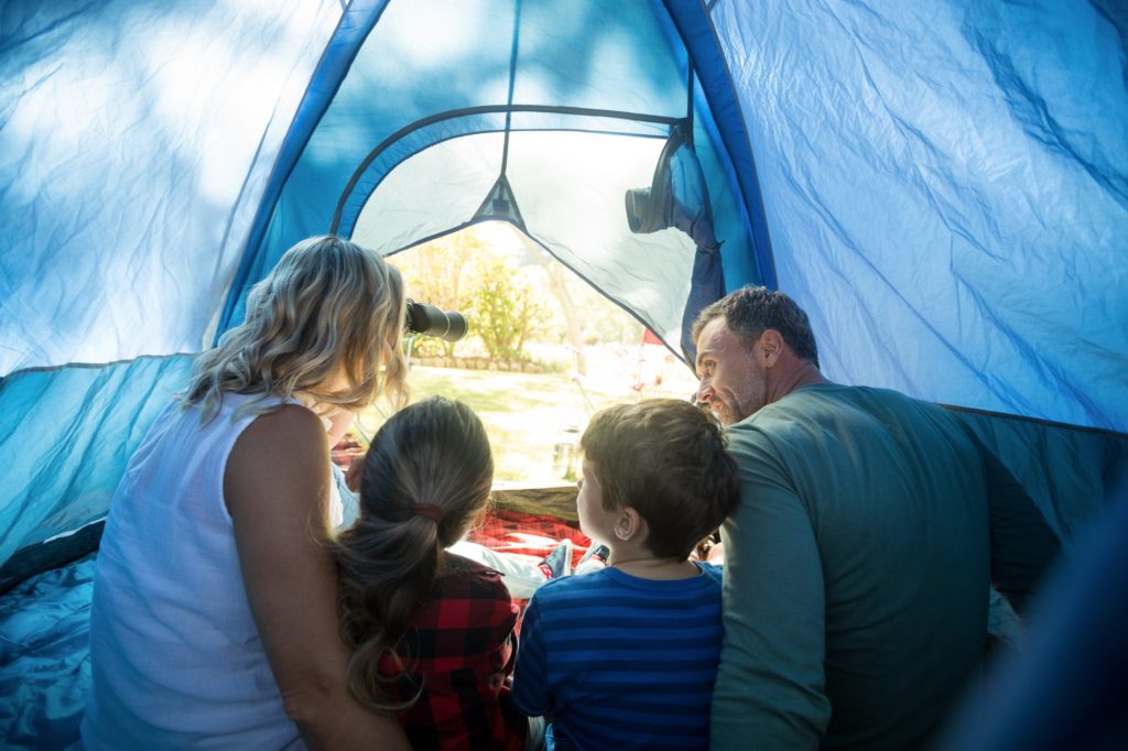 Family sitting in the tent